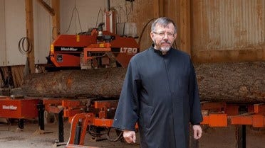 The abbot Emil Yakimov manages the restoration